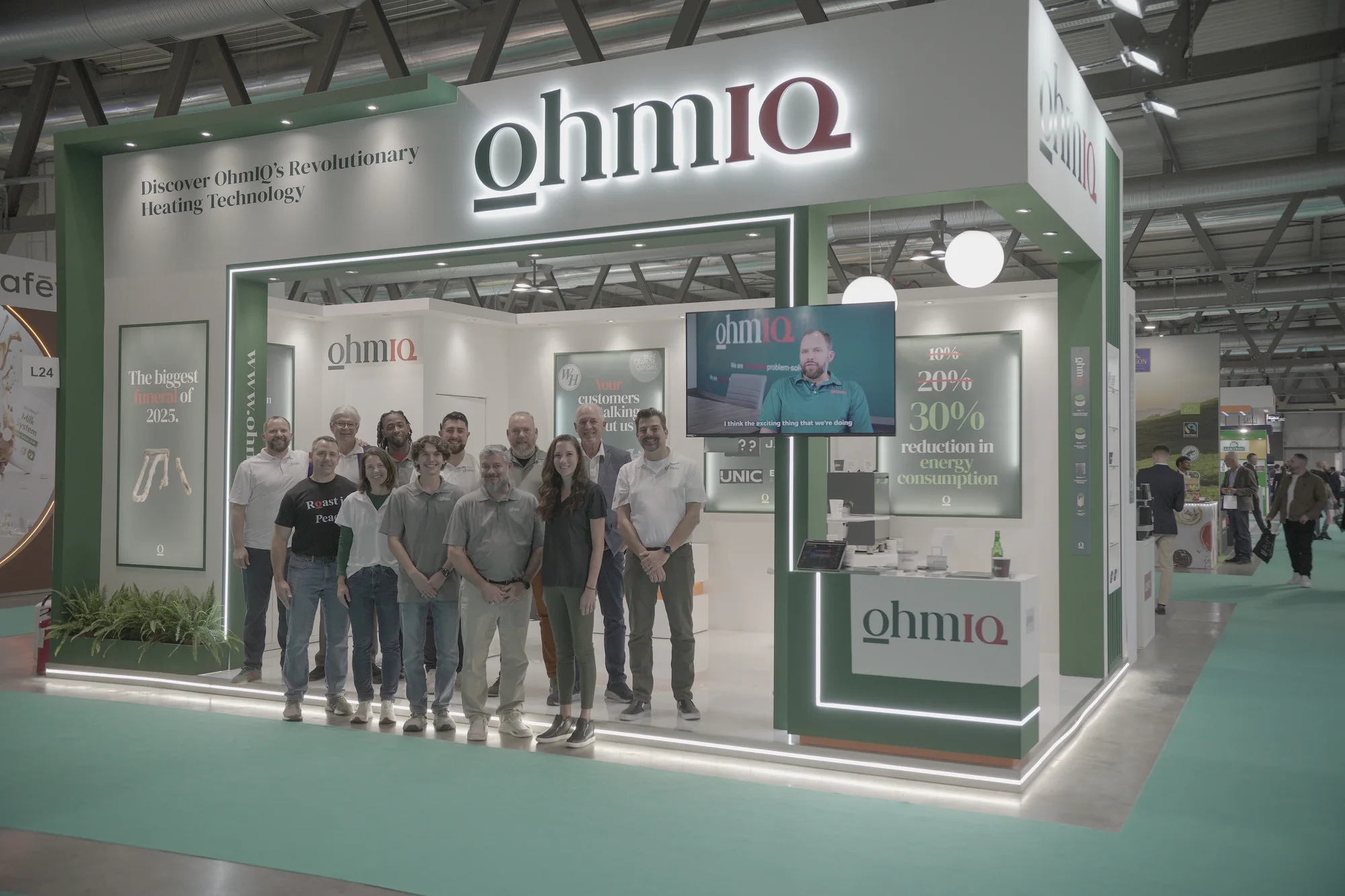 The OhmIQ team in front of their exhibition stand at HOST Milano